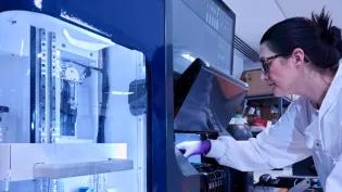 A researcher in a lab coat.